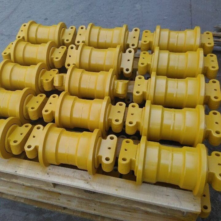 Deeltjes van graafmachines onder het chassis van de toprol van de spoorrol, van de tandwiel van de ijlrol, van de onderrol van de spoorrol