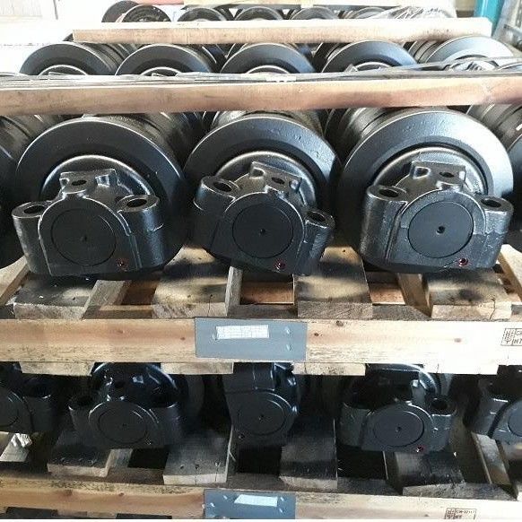 Deeltjes van graafmachines onder het chassis van de toprol van de spoorrol, van de tandwiel van de ijlrol, van de onderrol van de spoorrol